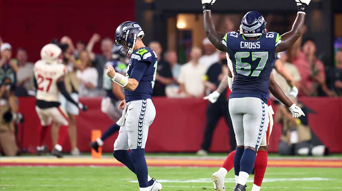 Seahawks quarterback Sam Darnold 14 and offensive tackle Charles Cross 67 celebrate zQTlLK