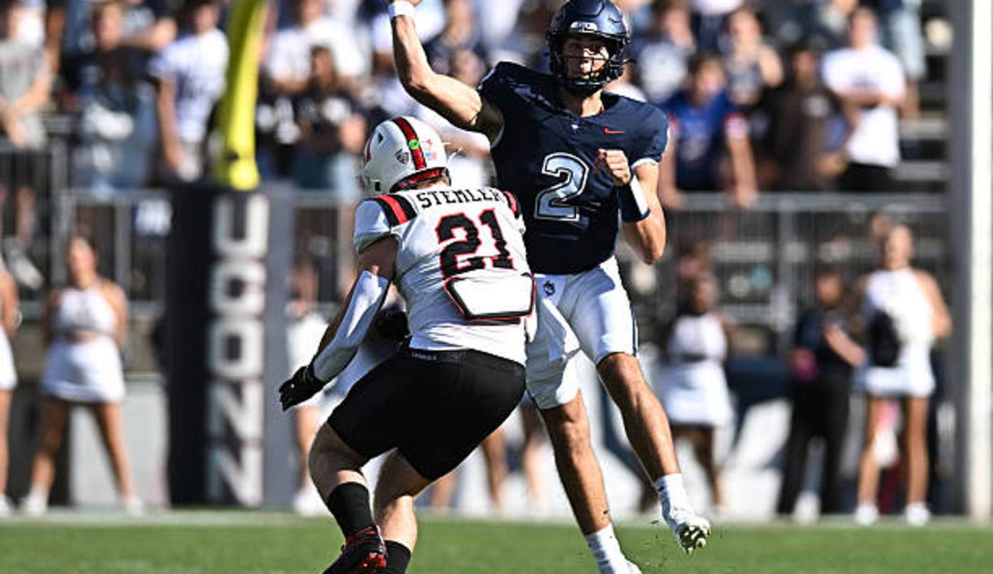 east hartford ct quarterback joe fagnano of the uconn huskies looks to pass while defended by lw4Xmo