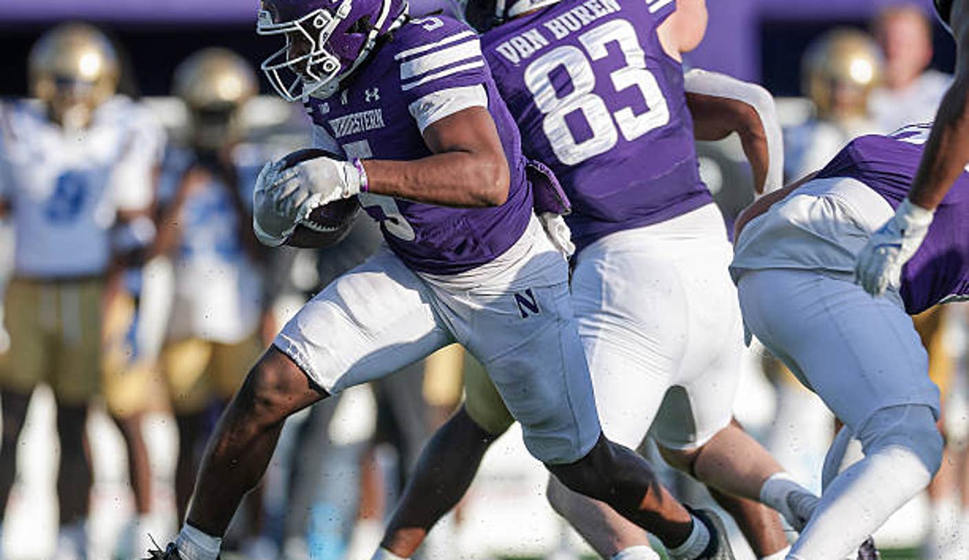 evanston illinois caleb komolafe of the northwestern wildcats runs the ball in the ncaa FNcqvP