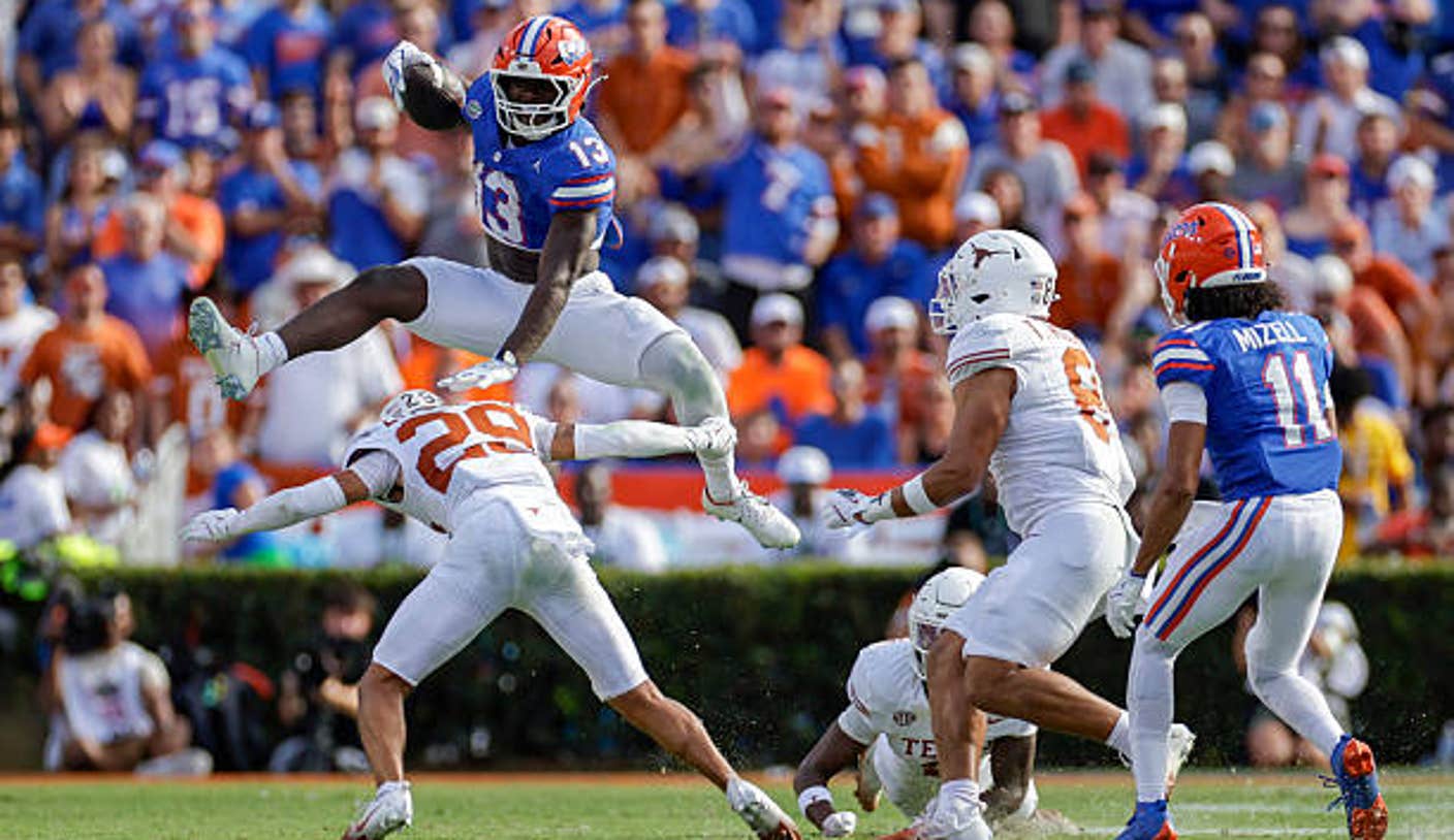 gainesville fl florida gators running back jadan baugh hurdles texas longhorns defensive back CM6gNg